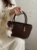 Bolso tejido de alta gama vintage para mujer, nuevo bolso cruzado versátil de moda 2026, bolso de mano para el trabajo, bolso de hombro tipo cubo