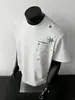 Camiseta de Manga Corta con Estampado de Copos de Nieve y Estrellas Estilo Retro Japonés para Hombre 2026 Verano Nueva Camiseta Holgada de Media Manga Top de Moda