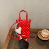 Nuevo bolso mini de lunares estilo coreano para principios de otoño de 2026, bolso cruzado de nicho y único, bolso cuadrado pequeño de moda para ir al trabajo