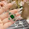 Camellia elegante elegante serie de gemas esmeralda traje para mezclar y combinar diseño hueco de diamantes completos colgante geométrico de gota de agua