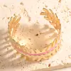 Pulsera geométrica calada de colores transfronteriza, lujo ligero con un toque de alta gama, pulsera abierta con goteo de aceite, accesorio de mano de diseño simple