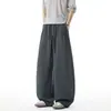 Pantalones de chándal anchos de estilo americano con dobladillo curvo para hombre, pantalones deportivos holgados y fluidos de peso pesado para primavera y otoño, pantalones largos casuales versátiles para hombre