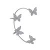 Nuevo temperamento transfronterizo de alta gama sin agujero en la oreja super flash mariposa aretes clip para la oreja para mujer personalidad diamante completo espíritu de hada aretes al por mayor
