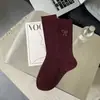 Calcetines de longitud media para mujer Otoño e Invierno 2025 Ankora Corazón Rojo Lazo Felpa Gris Elegante Calcetines para Mujer