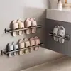 Sapateira de banheiro Sapateira de vaso sanitário Rack de pendurar na parede do vaso sanitário sem furos Rack de armazenamento Artefato