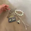 Colgante de Bolso de Cuerda Trenzada Corazón Hecho a Mano Vintage Dulce Fresco Flor Hueca Moda Versátil Exquisito Colgante de Bolso