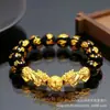 12mm obsidiana imitação ouro Pixiu venda ao vivo fornecimento transfronteiriço Passepartout pulseira banhada a ouro pequeno presente