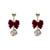 Aretes de borla con lazo flocado rojo vintage de otoño e invierno Aguja de Plata ins Año Nuevo rojo vino bola de piel aretes de perlas