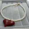 Estilo Dulce y Fresco Japonés y Coreano Ankora Lazo Rojo Colgante de Corazón Collar de Perlas Cadena para Clavícula