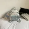 Mochila Super Fofa de Gatinho Feminina 2026 Nova Moda Rosto de Gato Versátil Mochila de PU para Passeios Viagem Pequena Bolsa Escolar