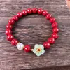 Una generación de arena de cristal de cinabrio bajo contenido de los productos de este año puesto de venta al por mayor de pulseras de flores