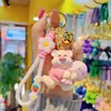 Billetera de resina de dibujos animados llavero de oso cadena de teléfono móvil femenina linda exquisita pulsera muñeca bolsa de la suerte llavero bolsa colgante