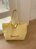 Bolsa de Lona con Estampado de Letras para Viajes Transfronterizos para Mujer 2026 Nueva Moda Gran Capacidad Versátil Ligera Bolso de Hombro