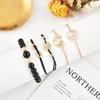 Estilo europeo y americano mapa de amor de flor hueca cadena de cuentas negras pulsera simple de 8 letras traje de cinco piezas venta al por mayor de fábrica