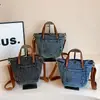 Bolso Cubo Texturizado de Mezclilla Desgastada Estilo Coreano Primavera Verano 2026 Nuevo Versátil Casual Pequeño Bandolera