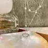 Colar Colar de Corrente para Clavícula com Pingente de Planeta de Pérola de Zircônio Estilo Coreano para Mulheres, Acessório de Nicho de Luxo Leve de Alta Qualidade