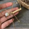 Clip de resorte con perla hueca y lazo de metal de Corea del Sur 2024, nuevo accesorio para el cabello con clip lateral para mujer