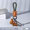 Llavero Creativo y Exquisito de Cuero para Cachorro de Coche Colgante de Bolso de Alta Gama para Niñas Accesorios de Pareja Joyería al por Mayor