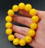 Pulsera de cera de abeja amarilla imitación pollo al por mayor diámetro 15 mm cuenta redonda cera de abeja ámbar pulsera pulsera al por mayor