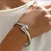1 Conjunto de Anel Geométrico Simples de Liga Pesada em Forma de Argola Pulseira Gargantilha Lisa para Mulheres Conjunto de Joias Cruzamento Atacado