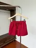 Falda casual de ajuste holgado con cintura elástica para mujer, nuevo estilo de verano, falda corta versátil de línea A con cordón anti-exposición