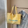 Bolsa de Lona Casual com Letras para Mulheres 2025 Nova Moda Tendência Coreana Bolsa Tote Grande Capacidade Bolsa de Viagem