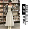 Falda de mujer blanca, vaporosa y elegante, nuevo estilo verano 2026, cintura alta elástica, corte holgado, falda de paraguas línea A de longitud media