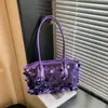 Bolso de diseñador único para mujer, bolso de noche de lentejuelas moderno y versátil, nuevo para la primavera de 2026, bolso tipo tote para llevar bajo el brazo para mujer