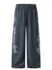 Calça de moletom da moda estilo americano, com estampa marmorizada, perna larga e cordão, para homens e mulheres, apresentando um design solto de perna reta, perfeita para outono e inverno