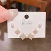 Verano nuevo chapado en oro real exquisitos tres pares de aretes pequeños de alto sentido pequeños frescos dulces aretes de temperamento combinables