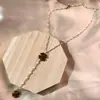 Bestseller transfronterizo: Collar de borlas en forma de Y de margarita para mujer, lujo ligero con un toque de alta gama, nicho y no se decolora