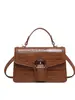 Bolso pequeño de mano de alta gama transfronterizo para mujer, nuevo diseño de moda, pequeño bolso cuadrado de lujo ligero, versátil para ir al trabajo, de un solo hombro, cruzado, moderno