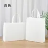 Bolsa de regalo publicitaria con recubrimiento de película a color bolsa de entrenamiento de compras palabra impresa a medida bolso de mano no tejido logo personalizado