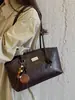 Bolso de axila para mujer elegante y a la moda, nuevo modelo de primavera, versátil, único, simple, color liso, gran capacidad, bolso de hombro de moda para el día a día