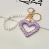 Llavero de Corazón Hueco con Pedrería Creativo Hecho a Mano Estilo Ins Versátil Colgante de Bolsa con Perlas en Forma de Corazón Regalo