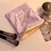 Linda bolsa de almacenamiento, bolsa de cosméticos estilo macarrón para mujer, nuevo modelo 2026, bolsa portátil para toallas sanitarias, bolsa de almacenamiento pequeña, monedero