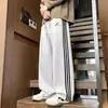 Pantalones deportivos estilo americano de tres rayas para hombre, nueva colección primavera/otoño 2026, pantalones rectos de corte holgado, pantalones largos casuales modernos y versátiles