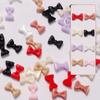 Joyería para uñas de lazo al por mayor explosiones netas rojas simples joyería para uñas de resina cinta tridimensional paquete de colores mixtos 50