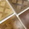 Piso laminado de parquet retro Versailles francés al por mayor casa de huéspedes tienda de ropa 12 mm resistente al desgaste