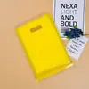 Bolsa de mano para ropa bolsa de regalo gruesa con remaches bolsa de cosméticos bolsa de embalaje con remaches hecha bolsa de plástico impresa con LOGOTIPO