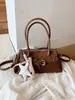 Bolsa de ombro retrô casual transfronteiriça para mulheres, nova versão coreana inverno 2025, bolsa de ombro estilo minimalista niche ins