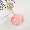 Chaveiro de Boneca Flutuante com Óleo Acrílico Pingente para Bolsa de Casal de Carro Pequeno Acessório Chaveiro de Areia Líquida