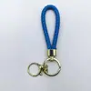 Venta al por mayor del fabricante Llavero de Cuerda de Aleación Tejida y Cuero Accesorios Colgantes Material PU Bolsas Pequeñas de Regalo Accesorios para Llaveros