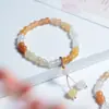 Venta al por mayor de fábrica Pulsera de anillo único Duobao de Jade Dorado pulsera de cuenta redonda Abaco rosa pulsera de anillo liso luantong de jade para mujer