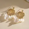 Pendientes de borla de flor de concha blanca transfronterizos europeos y americanos con perlas, pendientes de estilo de corte francés, pendientes ligeros y lujosos con un toque de alta gama