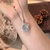 Pingente Natural de Jade Gelo Alto Feijão Fu Inlaid com Ovo de Pombo Novo Estilo Chinês Temperamento de Luxo Leve Banhado a Prata Inlaid com Buda