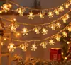 Cadena de luces de copo de nieve navideño LED luces pequeñas de colores cielo estrellado diseño festivo estrella de Navidad enchufe cadena de luces de copo de nieve pequeña