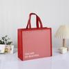 Bolsa de mano no tejida en stock, logotipo personalizado impreso, embalaje de regalo, bolsa de tienda de ropa de moda, bolsa de compras de ropa