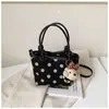 Bolso de mano nuevo de principios de otoño 2026, bolso tipo cubo casual estilo coreano, bolso de hombro y cruzado de moda con lunares único