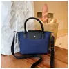 Bolso bandolera versátil para uso diario para mujer, gran capacidad, otoño 2026, estilo minimalista coreano, pequeño y único, adecuado para ir al trabajo
